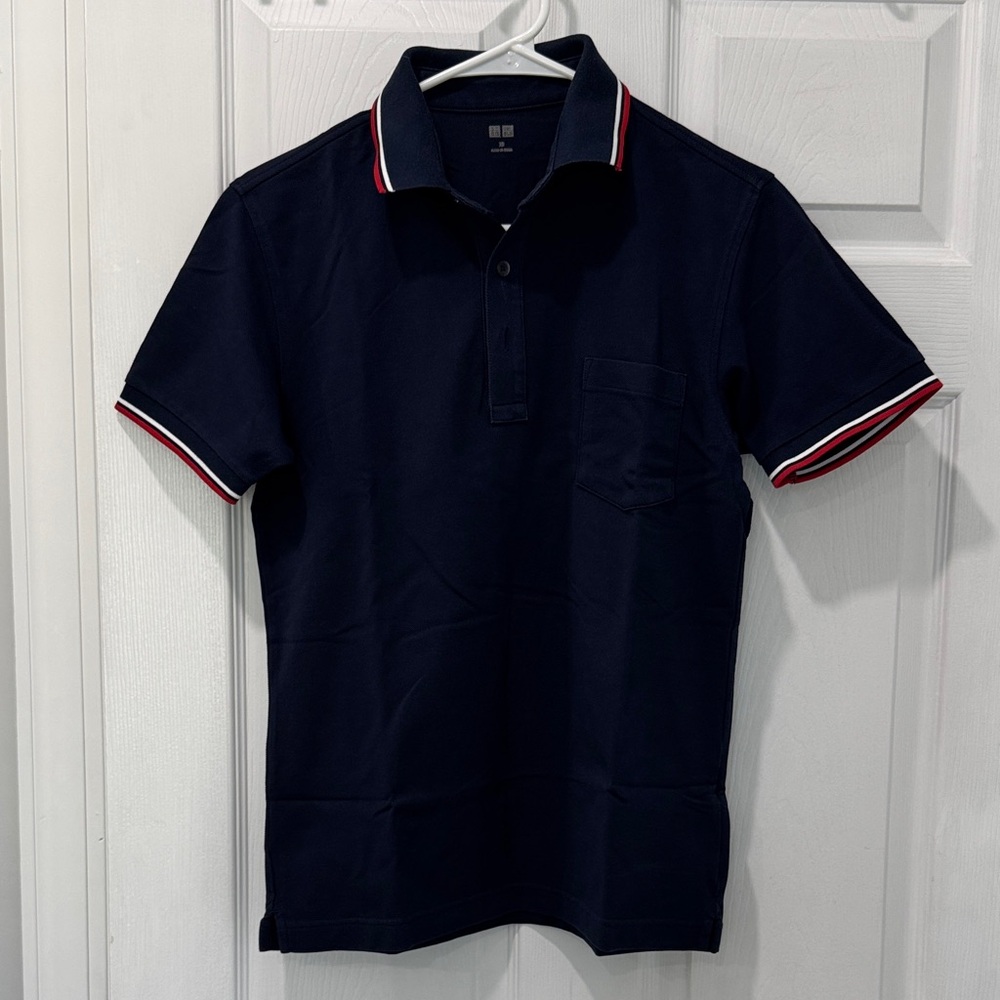 Uniqlo Men's Navy Polo Shirt with Red and White Accents